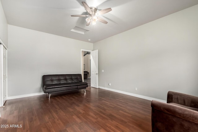 sitting room featuring ceiling fan, baseboards, and wood finished floors