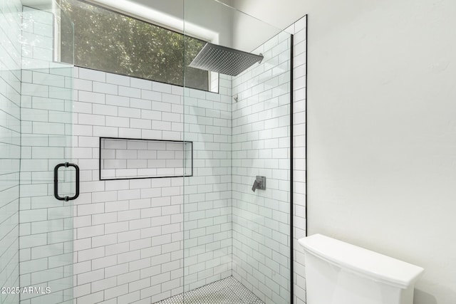 full bath with a stall shower and toilet