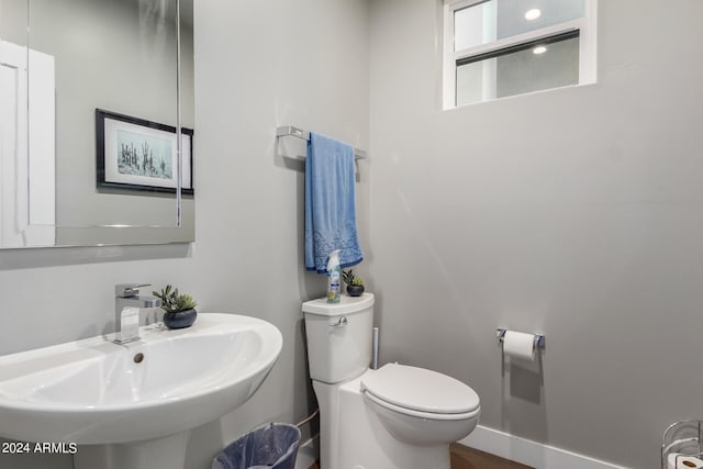 bathroom featuring sink and toilet