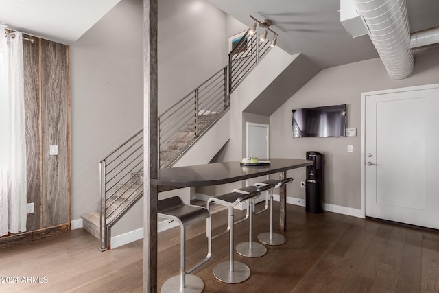 staircase featuring wood-type flooring