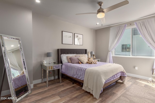 bedroom featuring ceiling fan and hardwood / wood-style flooring