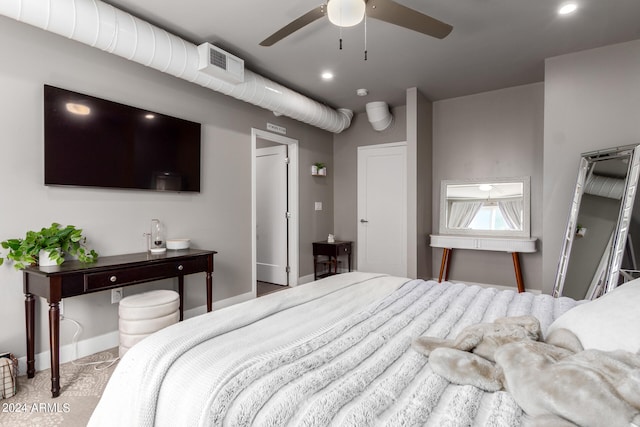 bedroom featuring ceiling fan and light carpet