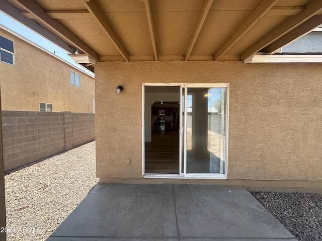 entrance to property with a patio