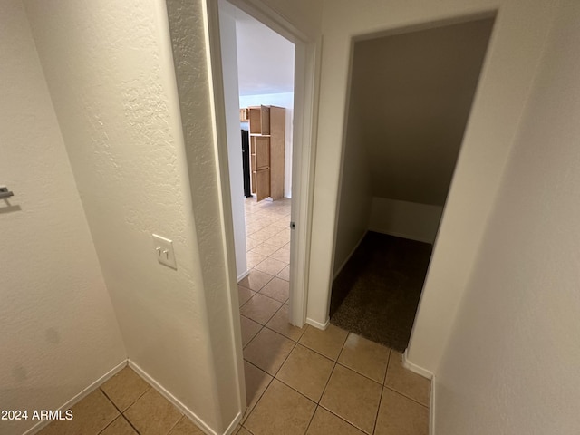 hallway with light tile patterned flooring