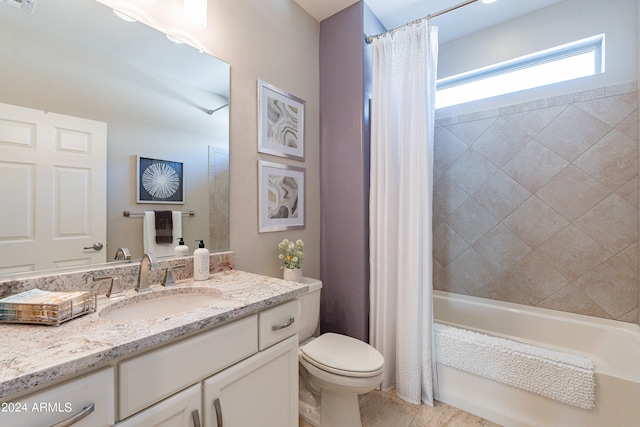 full bathroom with shower / bath combo, vanity, and toilet