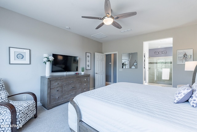 carpeted bedroom with ceiling fan and ensuite bathroom