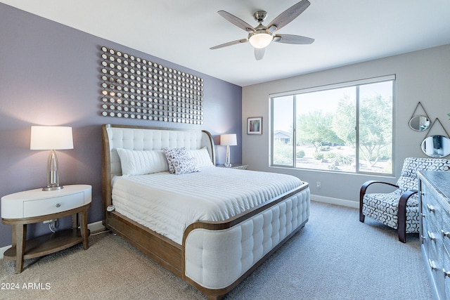 bedroom with light carpet and ceiling fan