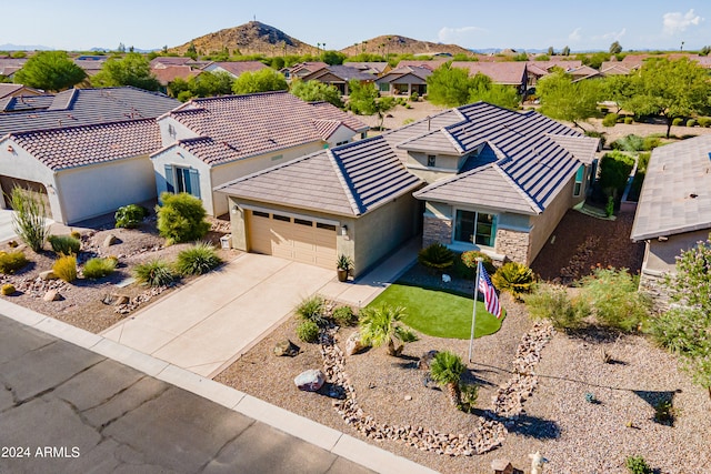 view of front of house featuring a mountain view and a garage