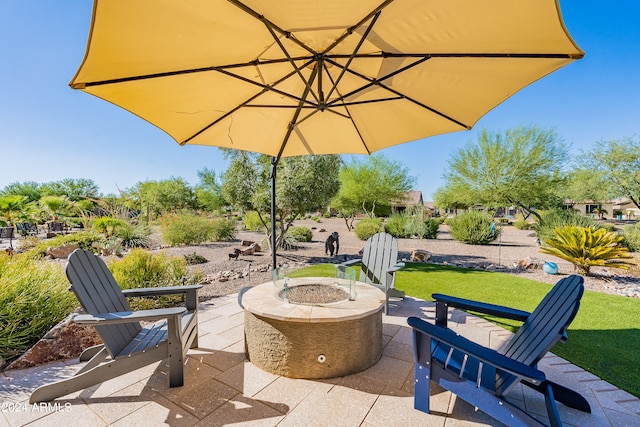 view of patio / terrace featuring an outdoor fire pit