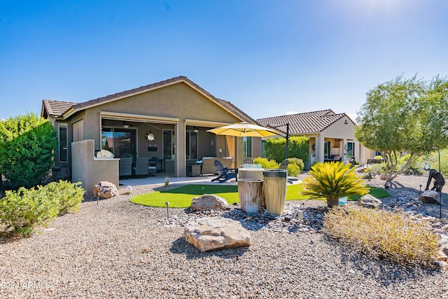 rear view of house featuring a patio and ceiling fan