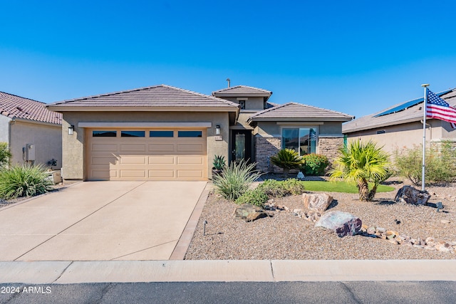 prairie-style house featuring a garage