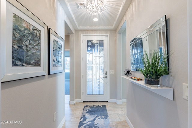 foyer with a tray ceiling