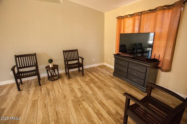 living area with light hardwood / wood-style floors