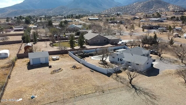 birds eye view of property with a mountain view