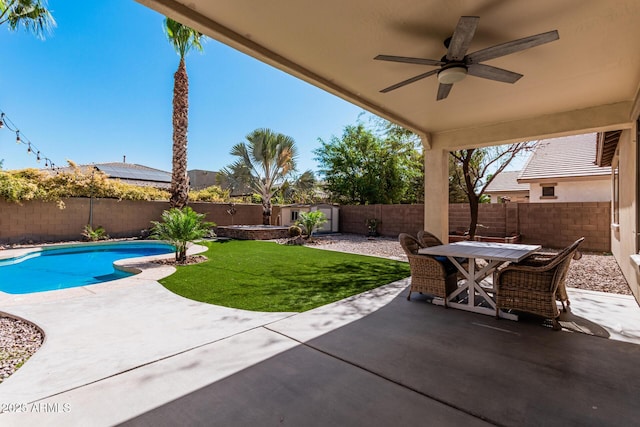 view of patio with a shed, ceiling fan, and a fenced in pool