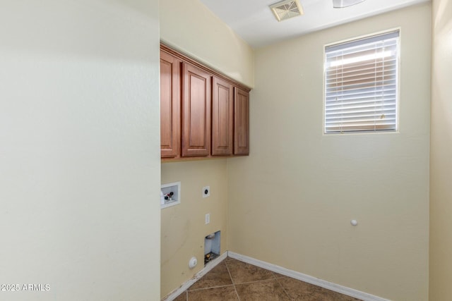 washroom featuring visible vents, gas dryer hookup, hookup for an electric dryer, cabinet space, and washer hookup