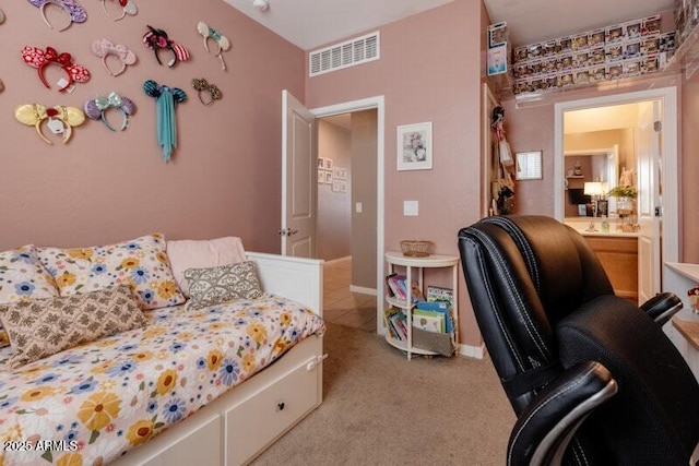 bedroom featuring light carpet and visible vents