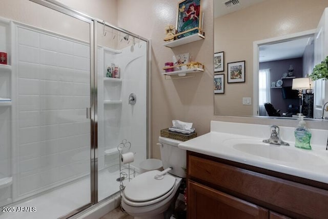 full bathroom with toilet, a shower stall, visible vents, and vanity