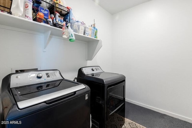 laundry room featuring laundry area, carpet flooring, independent washer and dryer, and baseboards