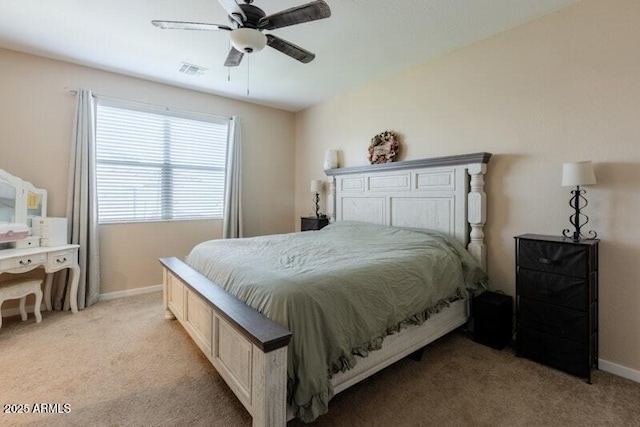 bedroom featuring light carpet, baseboards, visible vents, and a ceiling fan