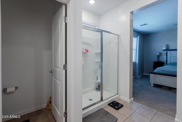 full bath featuring a stall shower, ensuite bath, and tile patterned floors