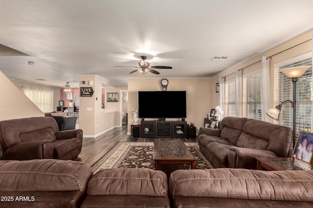 living room with dark wood-type flooring and ceiling fan