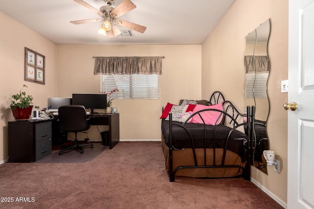 bedroom with ceiling fan and dark carpet