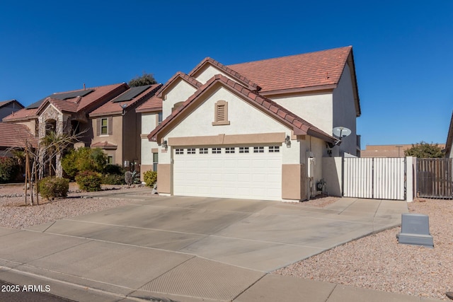 view of front of property featuring solar panels and a garage