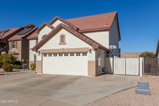 view of front of house featuring solar panels and a garage