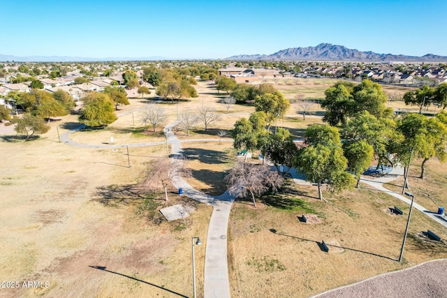 birds eye view of property with a mountain view