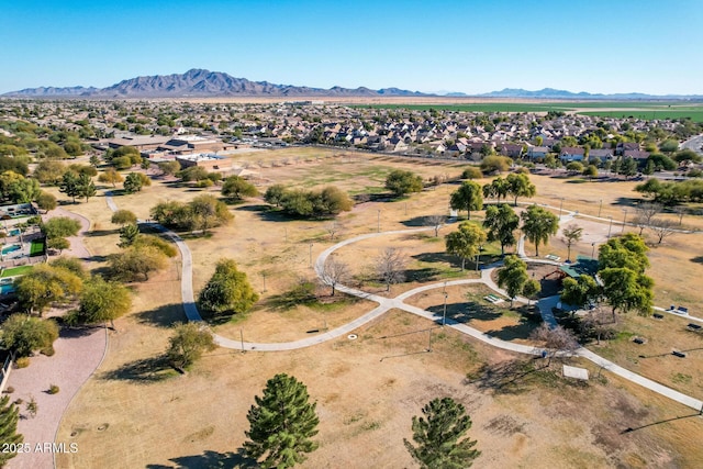 birds eye view of property with a mountain view