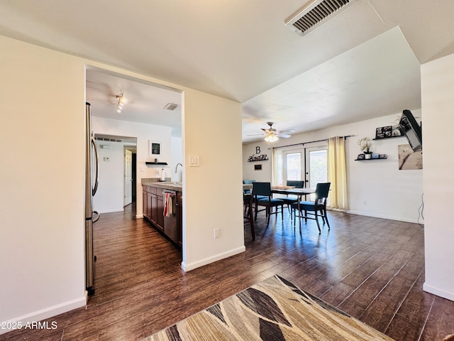 8343 E Edward Ave, Scottsdale, AZ 85250 - kitchen with dark wood-style flooring, a ceiling fan, light countertops, and appliances with stainless steel finishes