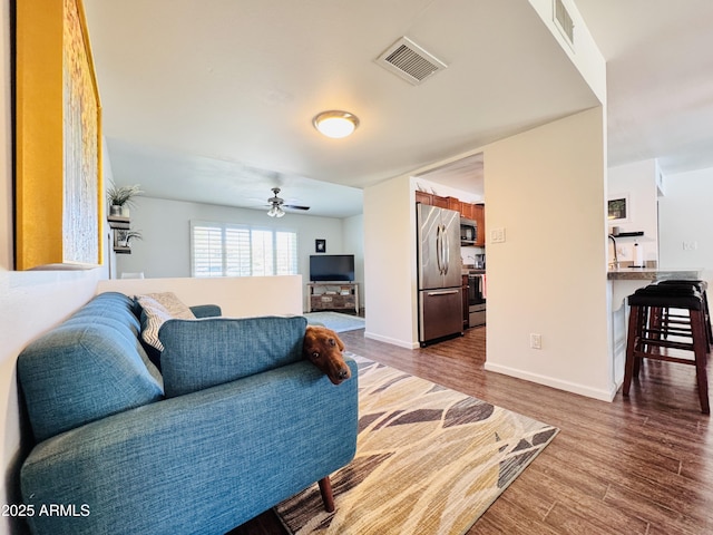 8343 E Edward Ave, Scottsdale, AZ 85250 - living area featuring a ceiling fan and dark wood-type flooring