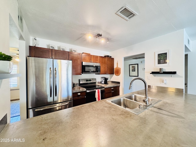 8343 E Edward Ave, Scottsdale, AZ 85250 - kitchen featuring appliances with stainless steel finishes and a peninsula