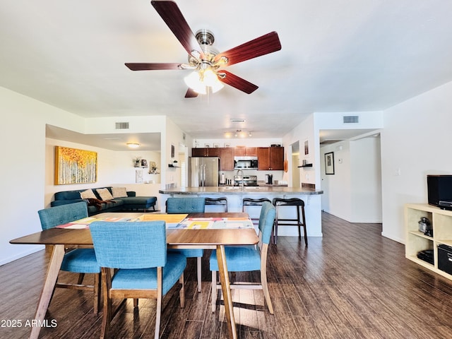 8343 E Edward Ave, Scottsdale, AZ 85250 - dining area featuring dark wood finished floors and a ceiling fan