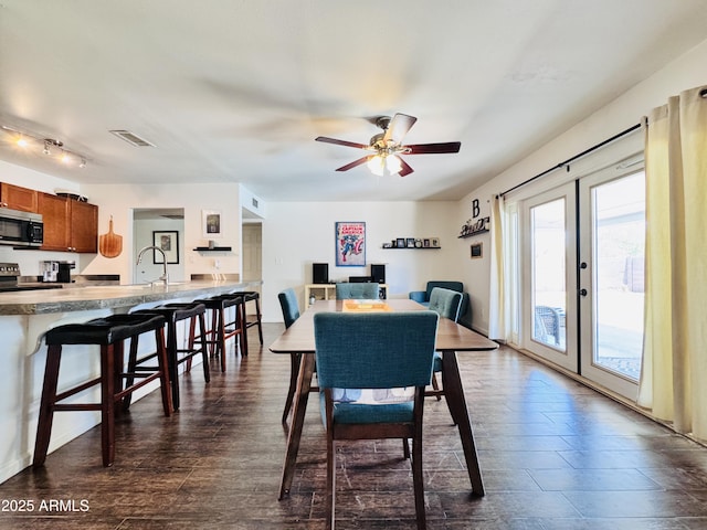 8343 E Edward Ave, Scottsdale, AZ 85250 - dining space with ceiling fan, french doors, and dark wood-style floors