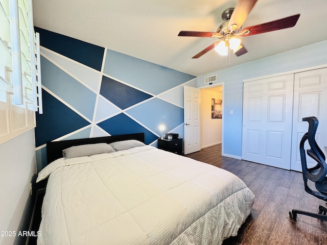 8343 E Edward Ave, Scottsdale, AZ 85250 - bedroom featuring wood finished floors, a ceiling fan, and a closet