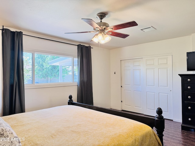 8343 E Edward Ave, Scottsdale, AZ 85250 - bedroom with dark wood-style flooring, a closet, and a ceiling fan