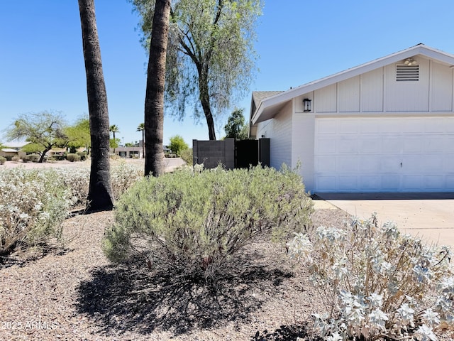8343 E Edward Ave, Scottsdale, AZ 85250 - view of side of property with driveway and an attached garage