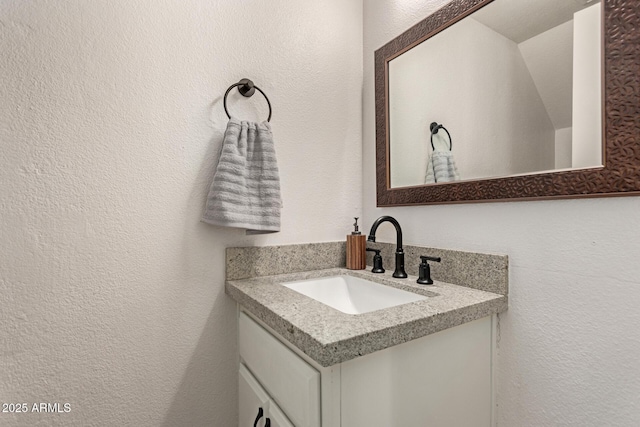 8841 S 48th St Unit 1, Phoenix, AZ 85044 - bathroom featuring vanity and a textured wall