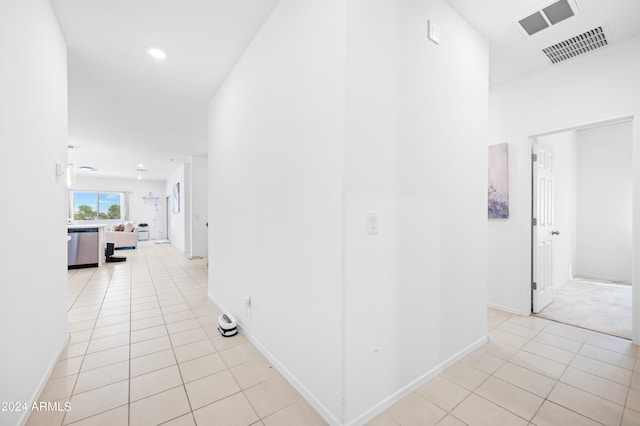 hallway featuring light tile patterned flooring