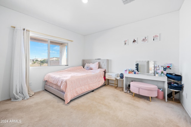 bedroom with light carpet