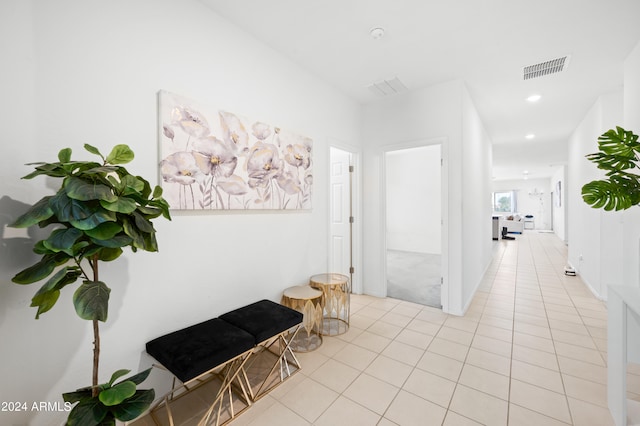 corridor featuring light tile patterned flooring