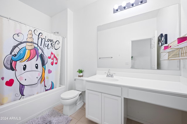 full bathroom featuring shower / bath combo with shower curtain, tile patterned floors, toilet, and vanity