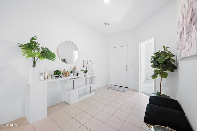 entrance foyer featuring light tile patterned floors