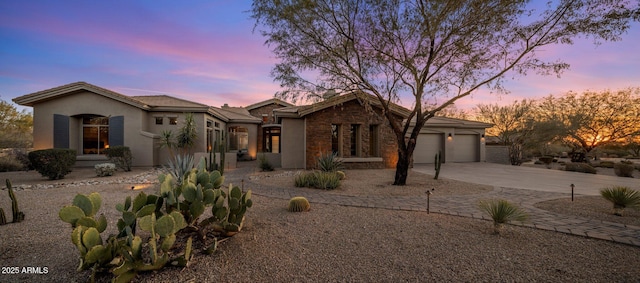 ranch-style home featuring a garage