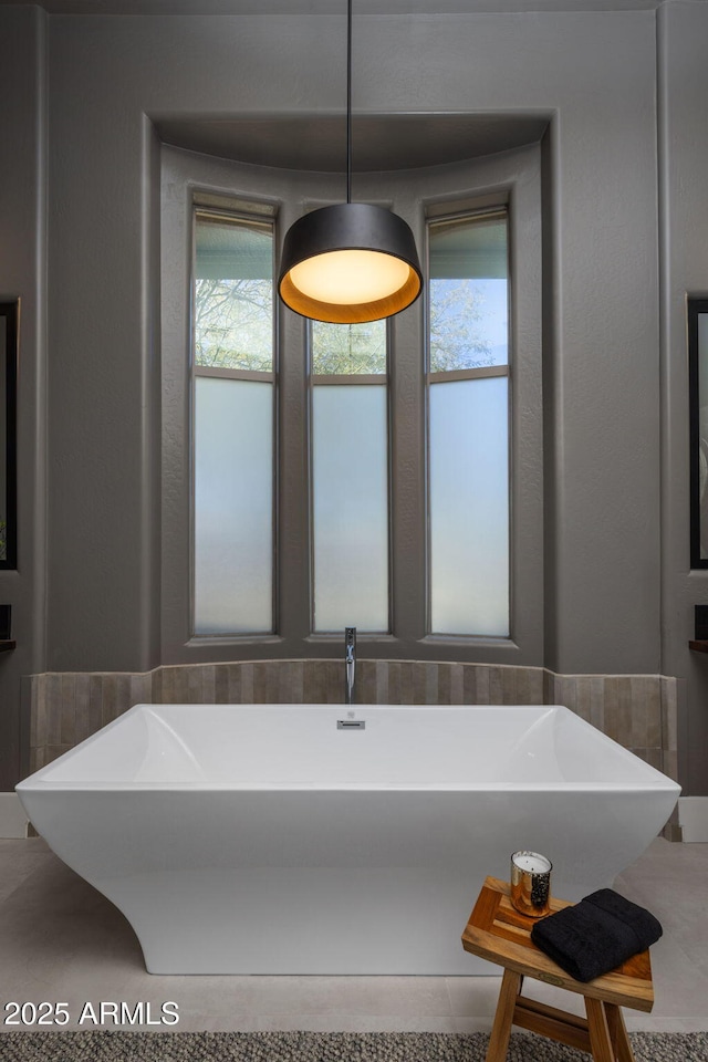 bathroom featuring a tub to relax in