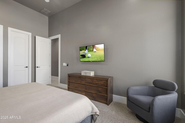 bedroom featuring light colored carpet