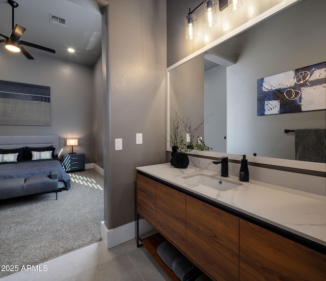 bathroom with tile patterned flooring, ceiling fan, and vanity