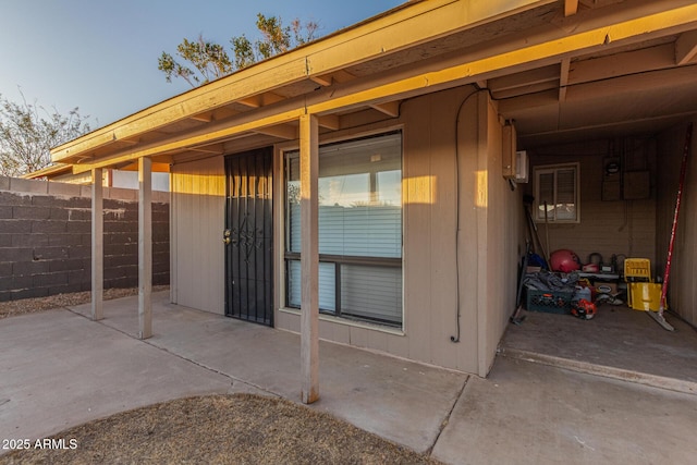 view of patio featuring fence